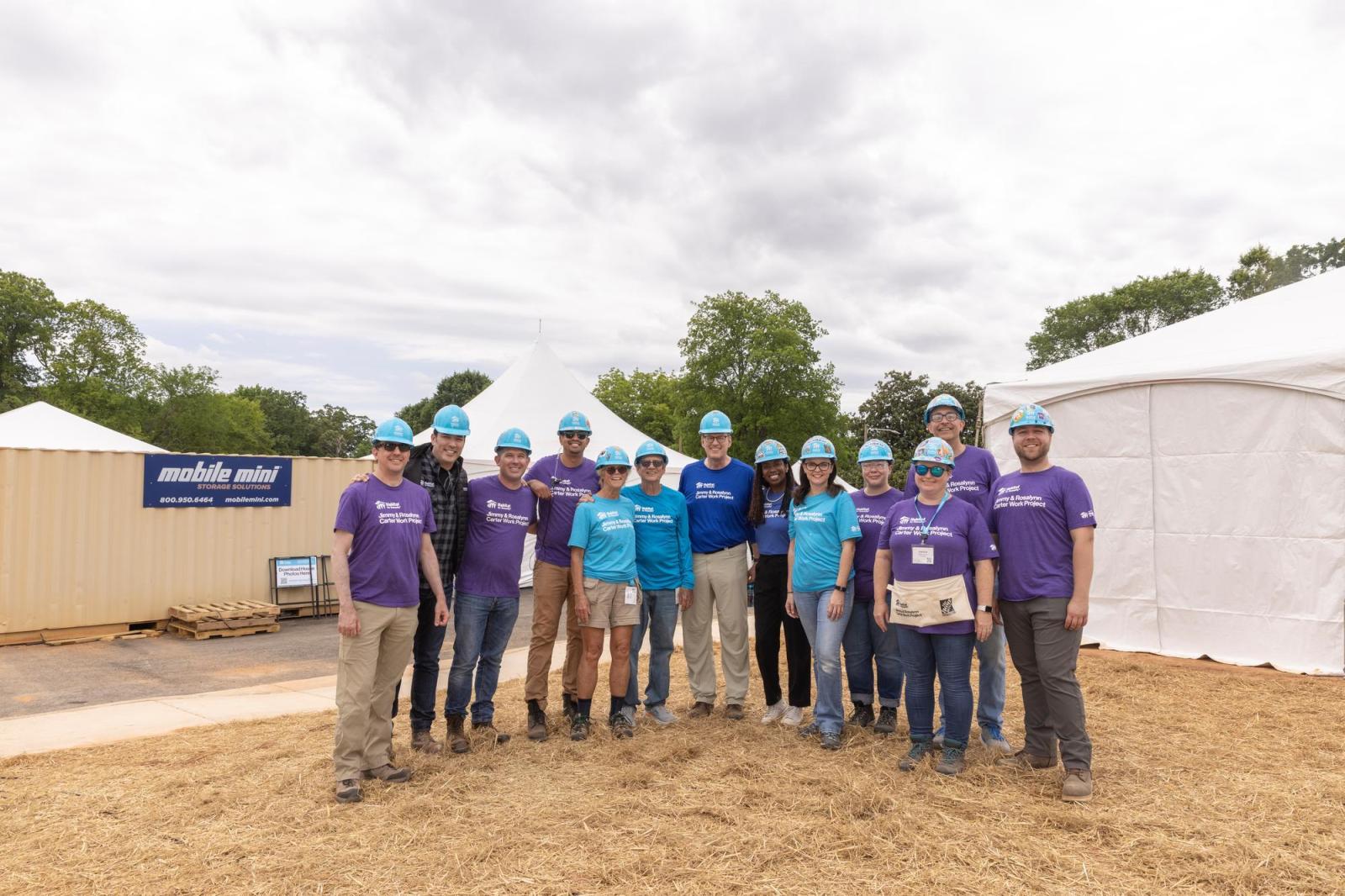 Media volunteers posing on site of Carter Work Project 2026 in Atlanta.