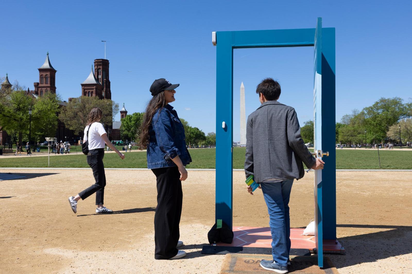Blue door frame with Washington Monument in the background. 