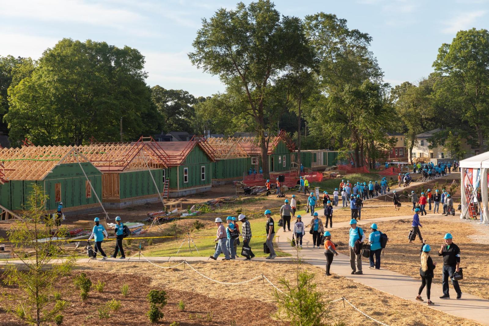 Wide shot of houses under construction at the 2026 Carter Work Project.