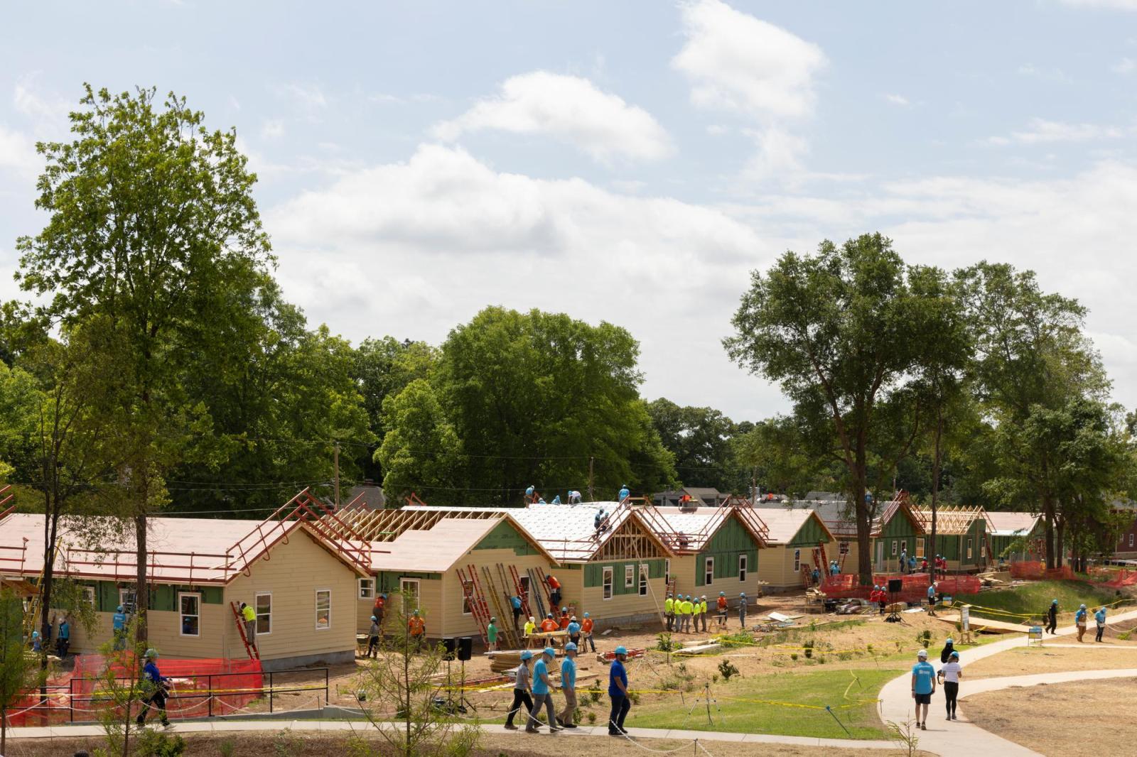 Wide shot of houses under construction at the 2026 Carter Work Project.