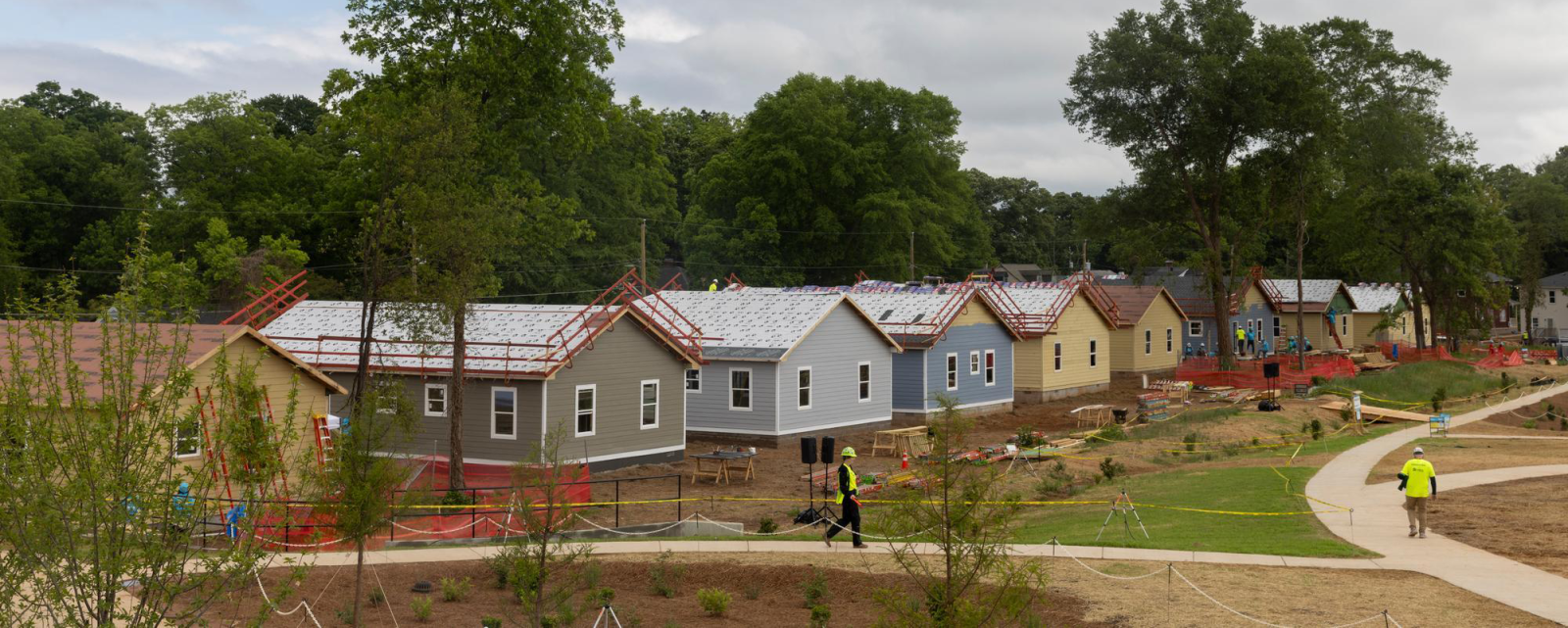 Wide shot of houses under construction at the 2026 Carter Work Project.