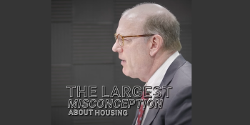 Profile view of Jonathan Reckford speaking at UN-Habitat. A text overlay reads, "The largest misconception about housing."