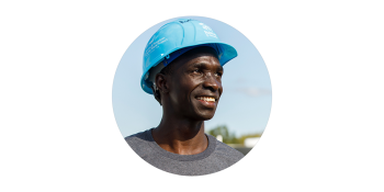 Headshot of Ronald smiling wearing a blue hardhat