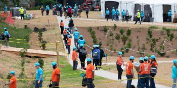Volunteers walk to their work sites in Langston Park during the 2026 Carter Work Project in Atlanta, Georgia. 